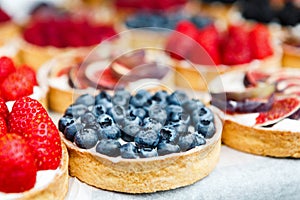 Closeup of blueberry tart dessert tray assorted