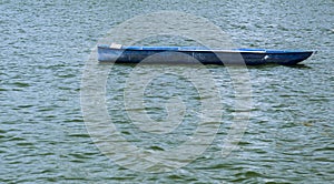 Closeup of a bluel  boat on the lake