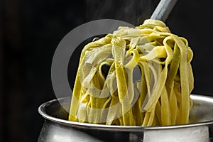 Closeup of boiling spaghetti pasta. put salt and olive oil inside water in the pot