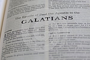 Closeup of the Book of Galatians from Bible, with focus on the Title of religious text. photo