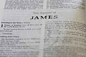 Closeup of the Book of James from Bible, with focus on the Title of religious text.