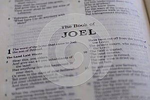 Closeup of the Book of Joel from Bible or Torah, with focus on the Title of Christian and Jewish religious text.