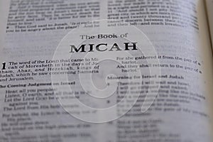 Closeup of the Book of Micah from Bible or Torah, with focus on the Title of Christian and Jewish religious text.