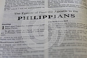 Closeup of the Book of Philippians from Bible, with focus on the Title of religious text. -