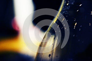 Closeup of a bottle with waterdrops