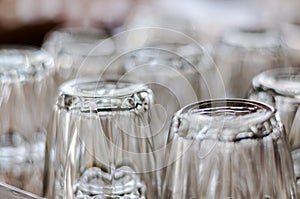 Closeup at bottom of upside down drinking glasses
