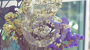 Closeup bouquet of dry yellow and purple flower