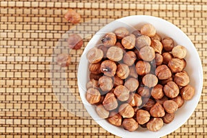 Closeup bowl many peeled hazelnuts