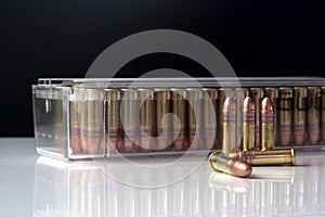 Closeup of box of .22 high velocity weapon ammunition with bullets in the front. Ammo. photo