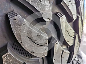 Closeup of a brand new studded tire tread. Selective focus.