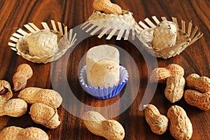 Closeup of brazilian dessert called PaÃ§oca with peanuts and straw hats. Festa junina food