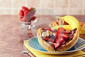 Closeup breakfast waffle fruit sandwich with chocolate spread