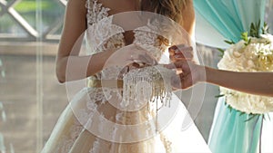 Closeup of a bride putting a gold wedding ring onto the groom`s finger. wedding rings and hands of bride and groom