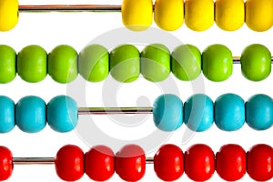 Closeup of bright abacus beads on white