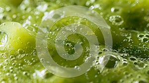 A closeup of a bright green algaebased smoothie with small bubbles visible on the surface. The drink appears thick and
