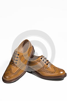 Closeup of Brogue Derby Shoes of Calf Leather with Rubber Sole On One Another Over Pure White Background