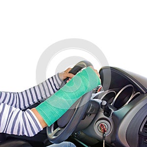 Closeup of a broken arm in a cast diving car on white b