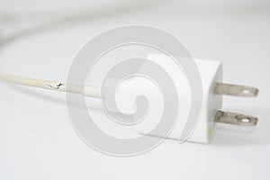 Closeup the Broken Charger Cable on white background