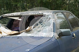 Closeup of broken front windshield on car after an accident.