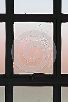 Closeup of a broken window of opaque glass