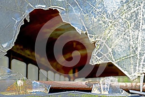 Closeup broken windshield in an abandoned bus.