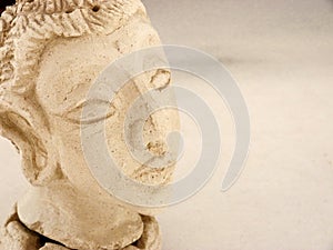 Closeup of Buddha head censer made in white mud 1