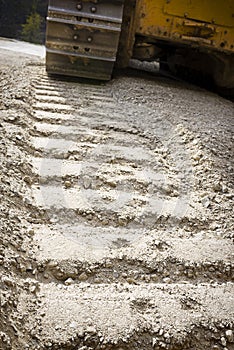 Closeup of a bulldozer track in the dirt