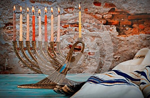 Closeup of a burning Chanukah candlestick with candles Menorah