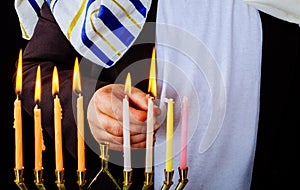 Closeup of a burning Chanukah candlestick with candles Menorah