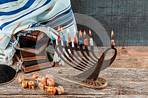 Closeup of a burning Chanukah candlestick with candles Menorah