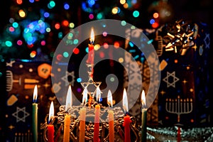 Closeup of a burning Chanukah candlestick with candles Menorah