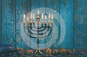 Closeup of a burning Chanukah candlestick with candles Menorah photo