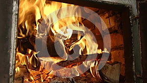 Closeup of burning fire in old stove. The old authentic Ukrainian oven.