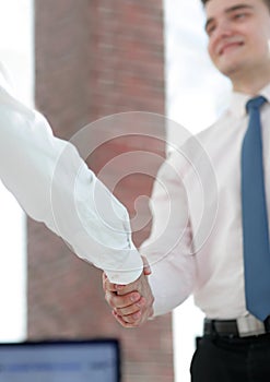 Closeup. business handshake.business background.