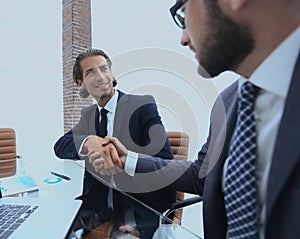 Closeup. business handshake in an office.