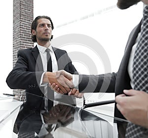 Closeup. business handshake in an office.