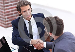 Closeup. business handshake in an office.