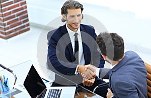 Closeup. business handshake in an office.