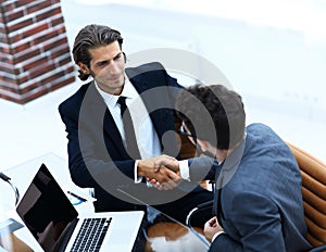 Closeup. business handshake in an office.