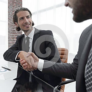 Closeup. business handshake in an office.