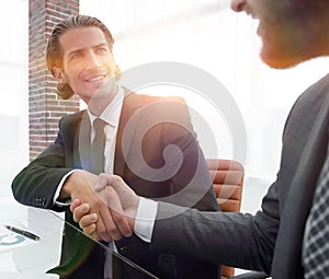 Closeup. business handshake in an office.