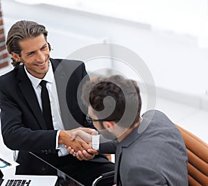 Closeup. business handshake in an office.