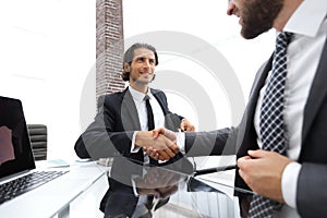 Closeup. business handshake in an office.