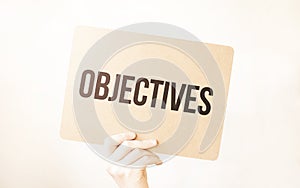 Closeup Business man hand holding show blank paper sheet mock up empty white board space for shouting text rule or protest word.