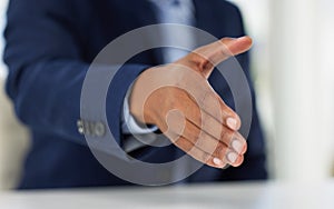 Closeup, business man and open handshake in office for welcome, recruitment or agreement in negotiation. Person, human