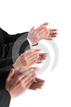 Closeup of business people hands applauding at white background.