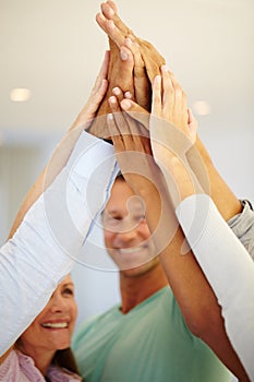 Closeup, business people and smile with high five in meeting for team building, partnership and support. Diversity