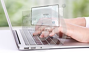 Closeup of business woman hand typing on laptop keyboard