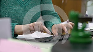 Closeup business woman hands typing on laptop keyboard in office. Office workers press buttons on a computer keyboard