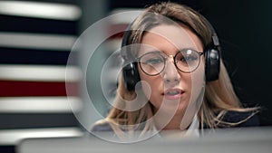 Closeup business woman headphones talking online video call. Shot with RED camera in 4K